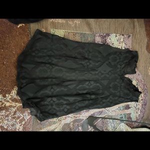 A lace black tank top. Buttons in the back. Wore 1 time.